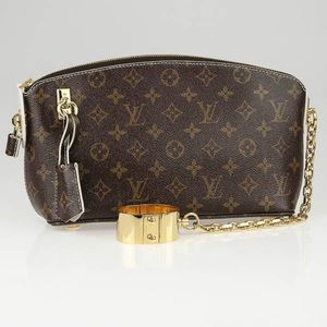 - Louis Vuitton Monogram Fetish Lockit Clutch